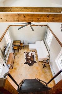 an overhead view of a living room in a tiny house at Olde Village Loft - Unique Park Circle Experience in Charleston