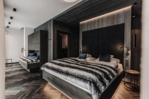 En eller flere senger på et rom på ONKL XONNA Premium Alpin Chalets
