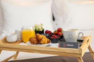 a tray of breakfast foods and coffee on a table at Abrazo Sofia Hotel by HMG in Sofia