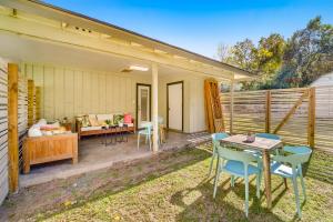 a patio with chairs and a table and a couch at The Mariposa Wing B by Lodgewell - Spread your wings here in Austin