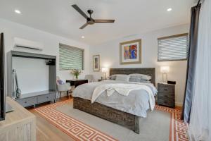 a bedroom with a bed and a large window at The Marymaker by Lodgewell - It's Super Suite Y'all in Austin