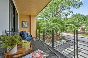 a balcony with a table and a view of the street at The Marymaker by Lodgewell - It's Super Suite Y'all in Austin