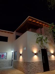 a white building with lights on it at night at Brisas del Mar ll in San Clemente del Tuyú
