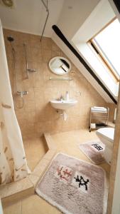a bathroom with a sink and a shower and a sink at Avoti in Līgatne