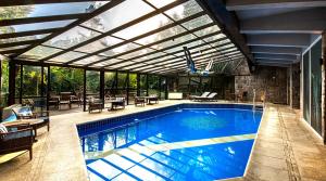 A piscina localizada em Hotel Casa da Montanha ou nos arredores