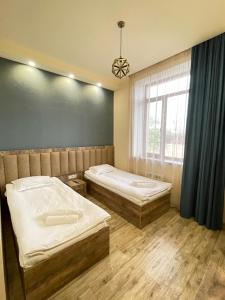 Postel nebo postele na pokoji v ubytování Glendale Boutique Hotel