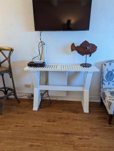 a white desk with a fish on top of it at Waterway Condo at Wrightsville! in Wilmington