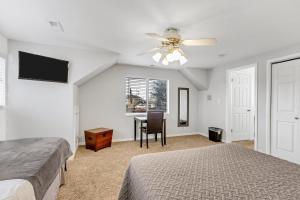 a bedroom with a bed and a ceiling fan at Large Room Near UVU & BYU in Orem