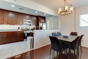 a kitchen and dining room with a table and chairs at 5 Bedroom Charmer with Pool in Reseda
