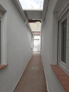 an empty hallway of a building with a window at Apartamento-Estudio B-3. in Madrid