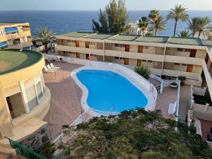 Bazén v ubytování SAN AGUSTIN SEAVIEW BLUE APARTMENT nebo v jeho okolí