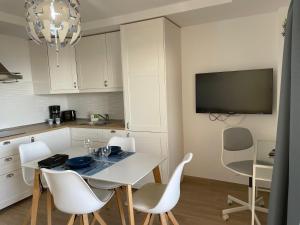 Kuchyň nebo kuchyňský kout v ubytování SAN AGUSTIN SEAVIEW BLUE APARTMENT