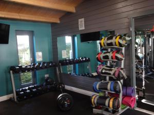 a gym with a rack of dumbbells and a mirror at Bowness Bed & Breakfast Double Room, Bowness-on-Solway in Bowness-on-Solway
