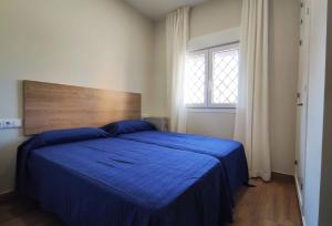 Postel nebo postele na pokoji v ubytování APARTAMENTOS SANLUCAR CASA C