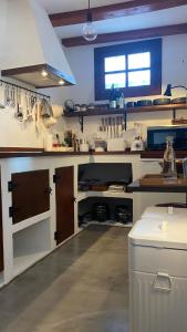 a large kitchen with a lot of appliances in it at Casa Moni con Vistas al Mar in Playa de Santiago