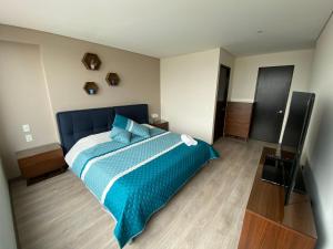 Ένα ή περισσότερα κρεβάτια σε δωμάτιο στο Napoles Suites +1 φωτογραφίες