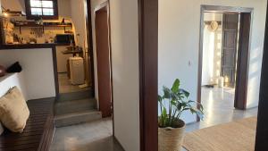 a living room with a staircase and a plant at Casa Moni con Vistas al Mar in Playa de Santiago +37 photos