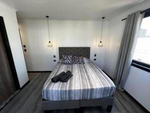 Cama ou camas em um quarto em VOY Hostales - Oriente