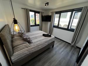 Cama ou camas em um quarto em VOY Hostales - Oriente