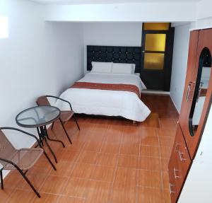 Postel nebo postele na pokoji v ubytování Cusco de mis Sueños Hostal - II