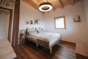 a bedroom with a bed in a room at Die Wiesen Apartments in Innsbruck