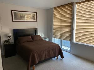 Ένα ή περισσότερα κρεβάτια σε δωμάτιο στο Napoles Suites