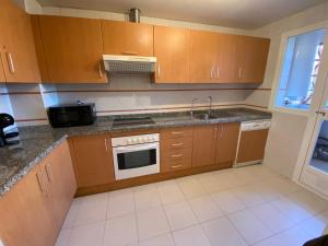 A kitchen or kitchenette at Spacious and stylish penthouse in Mijas