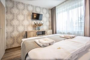 Posteľ alebo postele v izbe v ubytovaní Hotel Demanova Apartments - Dependance