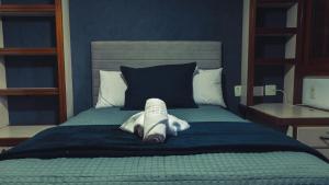 Cama ou camas em um quarto em Urbanature Filme & Arte