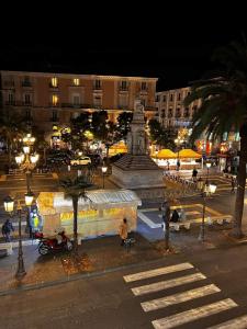 a large monument in a city at night at Toscano Palace Luxury Rooms Catania in Catania