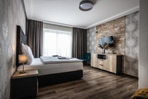 Posteľ alebo postele v izbe v ubytovaní Hotel Demanova Apartments - Dependance