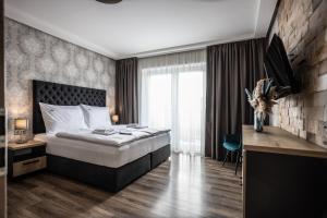 Posteľ alebo postele v izbe v ubytovaní Hotel Demanova Apartments - Dependance
