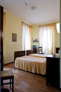 Postel nebo postele na pokoji v ubytování Albergo Centrale