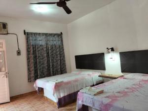 Postel nebo postele na pokoji v ubytování Hotel Posada Quetzal