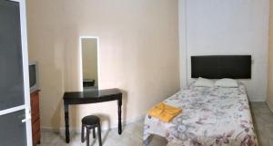 Postel nebo postele na pokoji v ubytování Hotel Posada Quetzal
