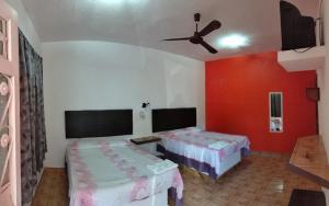 Postel nebo postele na pokoji v ubytování Hotel Posada Quetzal + 5 fotografií