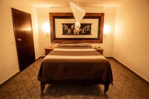 Un ou plusieurs lits dans un hébergement de l'établissement Hotel boutique Teocalli