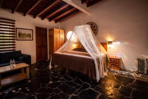 Un ou plusieurs lits dans un hébergement de l'établissement Hotel boutique Teocalli