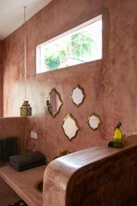 a bedroom with a large bed and a window at Segredo Uluwatu in Uluwatu +152 photos
