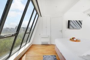 Posteľ alebo postele v izbe v ubytovaní Exceptional triplex with terrace - Montmartre + 11 fotografií