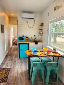 a kitchen with a table with four chairs and a counter at TCR at 290 Wine Trail #13 Now dog friendly in Hye