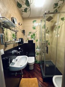 a bathroom with a shower and a toilet and a sink at Estes in Crotone
