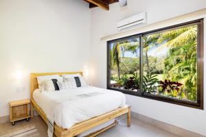 Cafe Playa Negra Hotel客房内的一张或多张床位