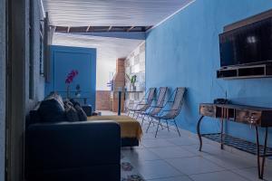 Khu vực ghế ngồi tại Casa c ótima localização piscina e WiFi, Cuiabá