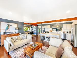 a living room with a couch and a table at Montana in Mount View