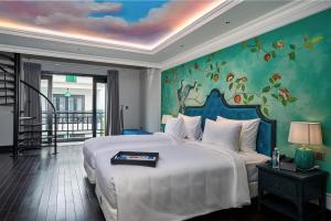 Postel nebo postele na pokoji v ubytování Hoi An Delicacy Hotel & Spa + 37 fotografií