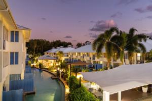 an aerial view of the resort at night at Silkari Lagoons Port Douglas in Port Douglas