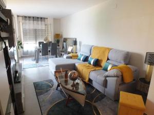 a living room with a couch and a table at Apartamento Roses, 2 dormitorios, 4 personas - ES-204-46 in Roses