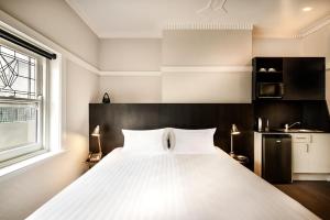 Postel nebo postele na pokoji v ubytování Como Court Budget Accommodation