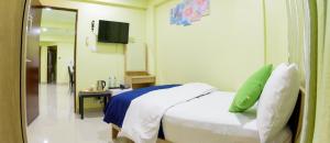 Postel nebo postele na pokoji v ubytování Tourist Inn